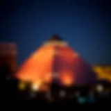 The striking silhouette of the Las Vegas pyramid illuminated at night