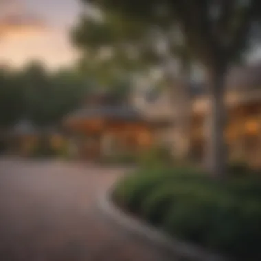 Exterior view of Two Trees Inn at sunset with serene landscaping.